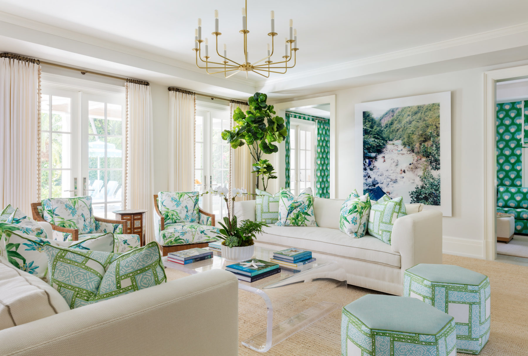 image of Tropical Oasis seating area with neutral sofas, walls, and curtains, with green and blue accessories
