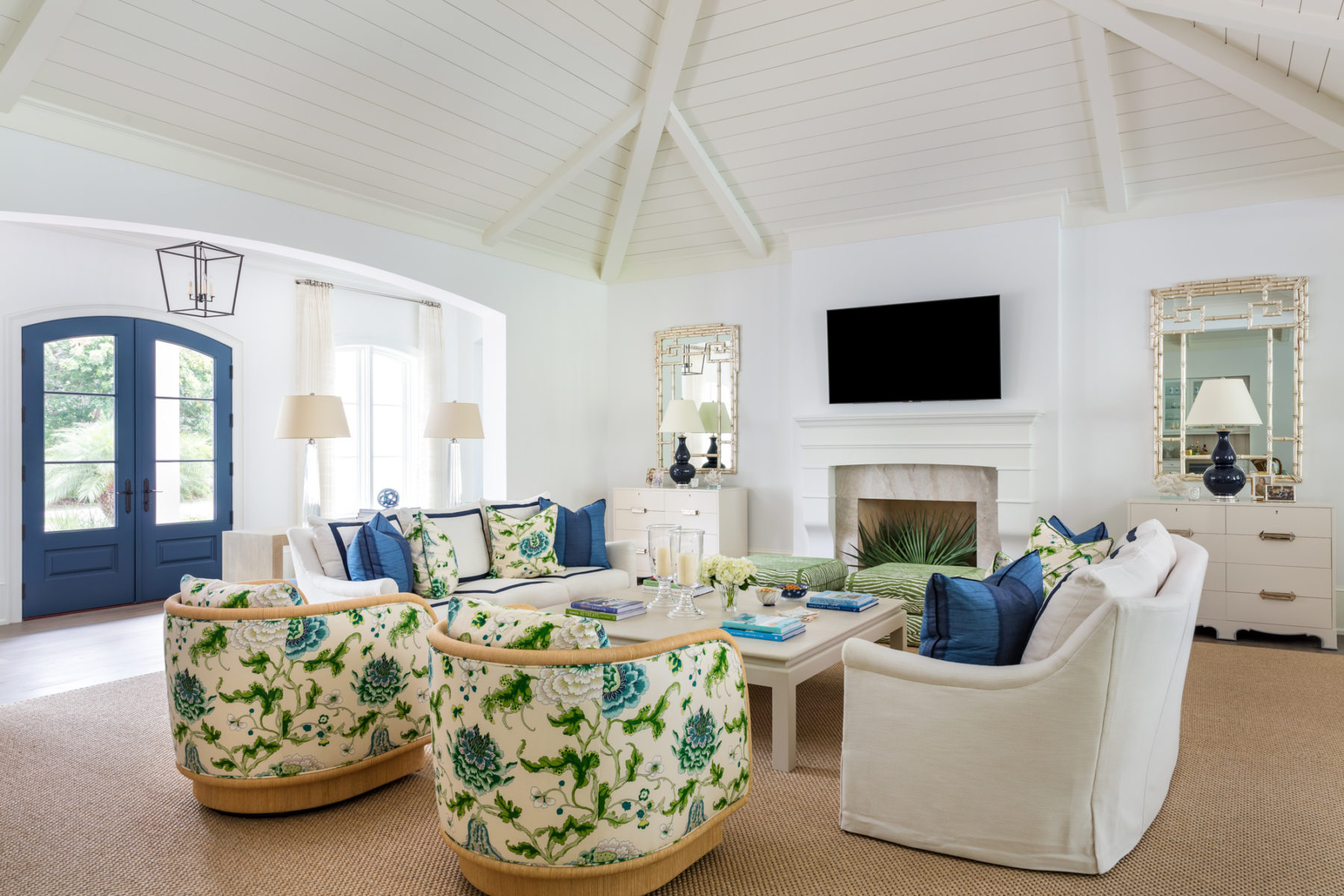 image of John's Island Home living room with white sofas and green floral chairs and pillows