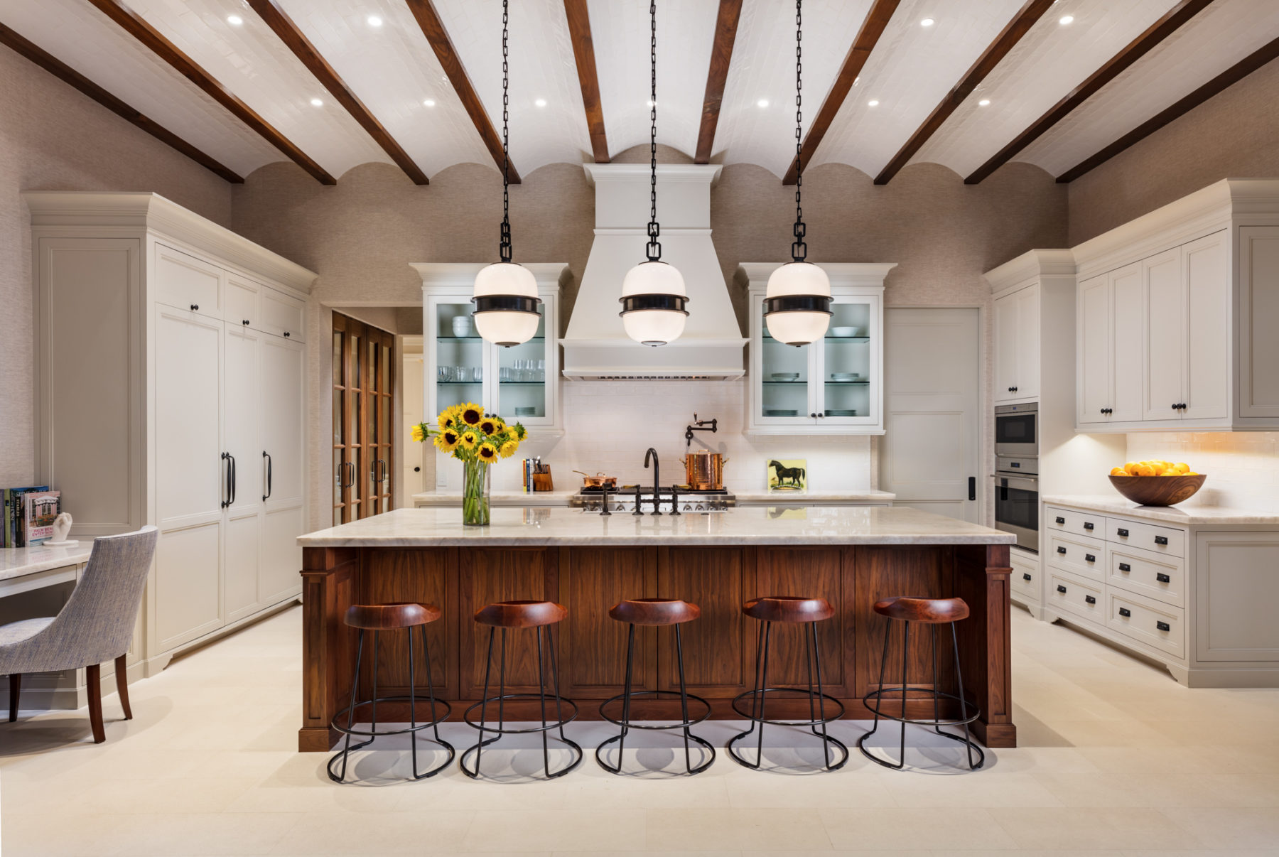image of Equestrian Estate kitchen with neutral cabinets, wood accents and brown barstools