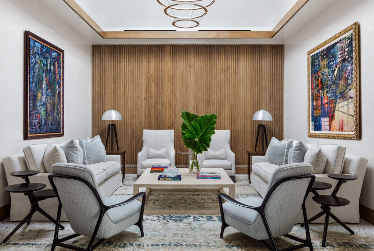 modern living room with wood paneling on far wall and modern furniture