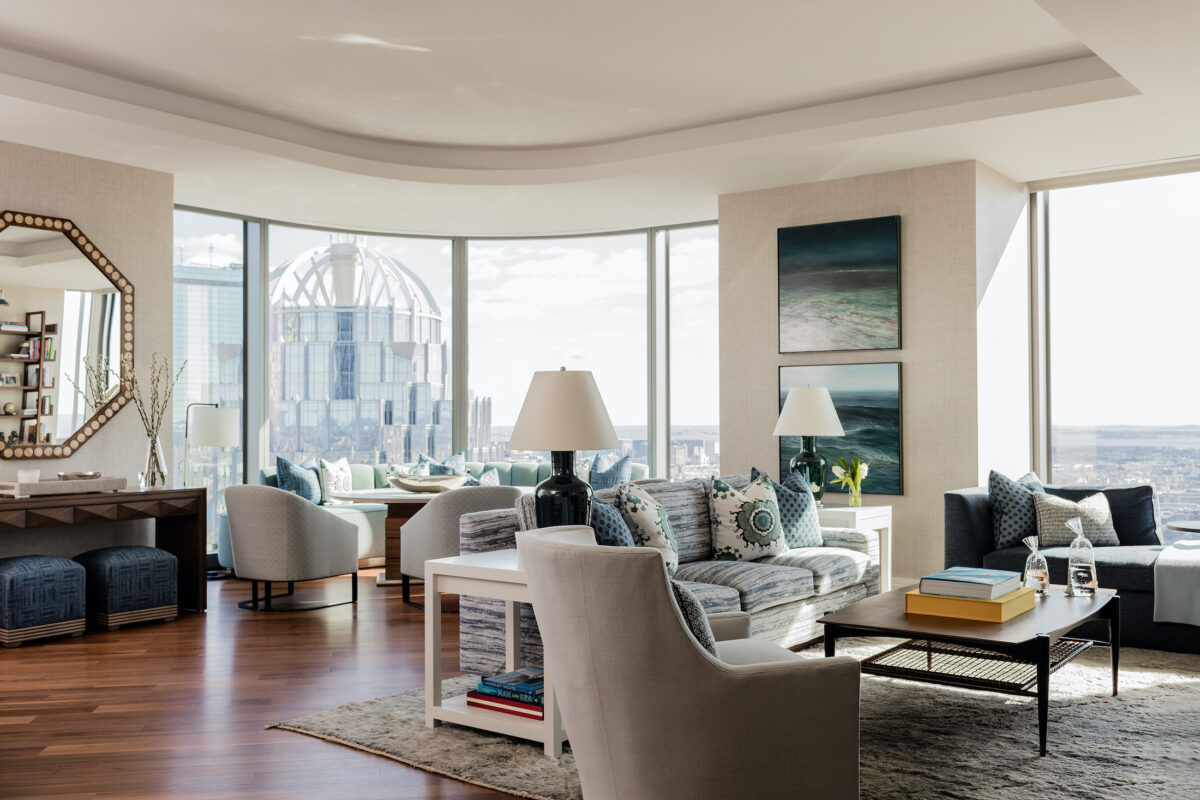 living room and dining room with large windows overlooking city