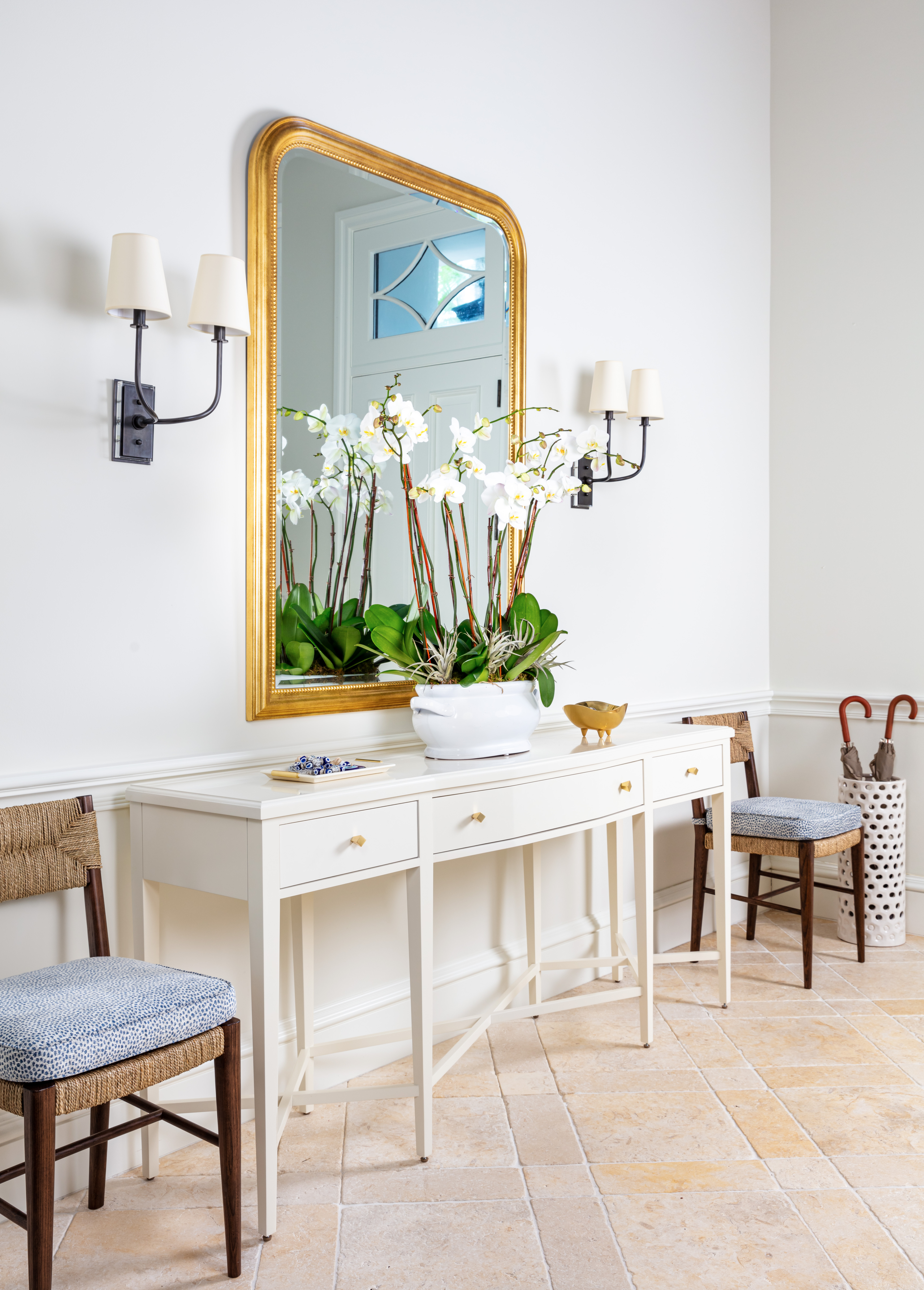 Image of Mediterranean On Sunset entry vignette with white console and gold mirror