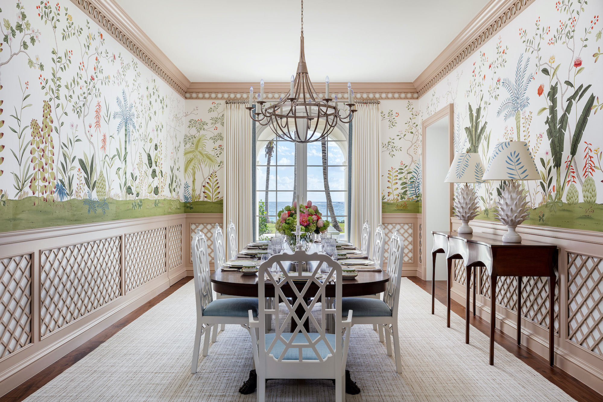 dining room with garden mural on top half of walls and lattice work on bottom
