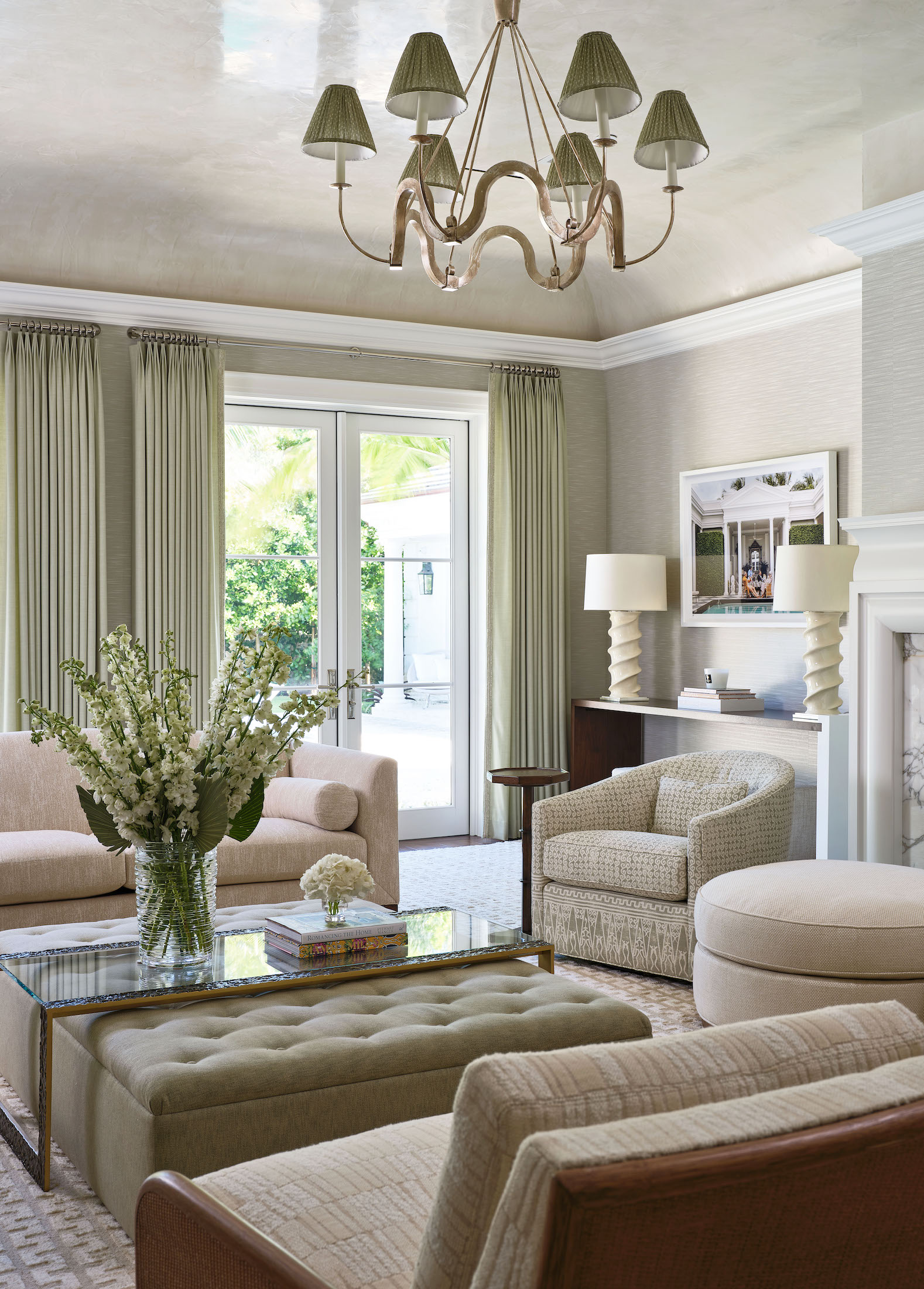 corner of living room with beige and green accents and french doors
