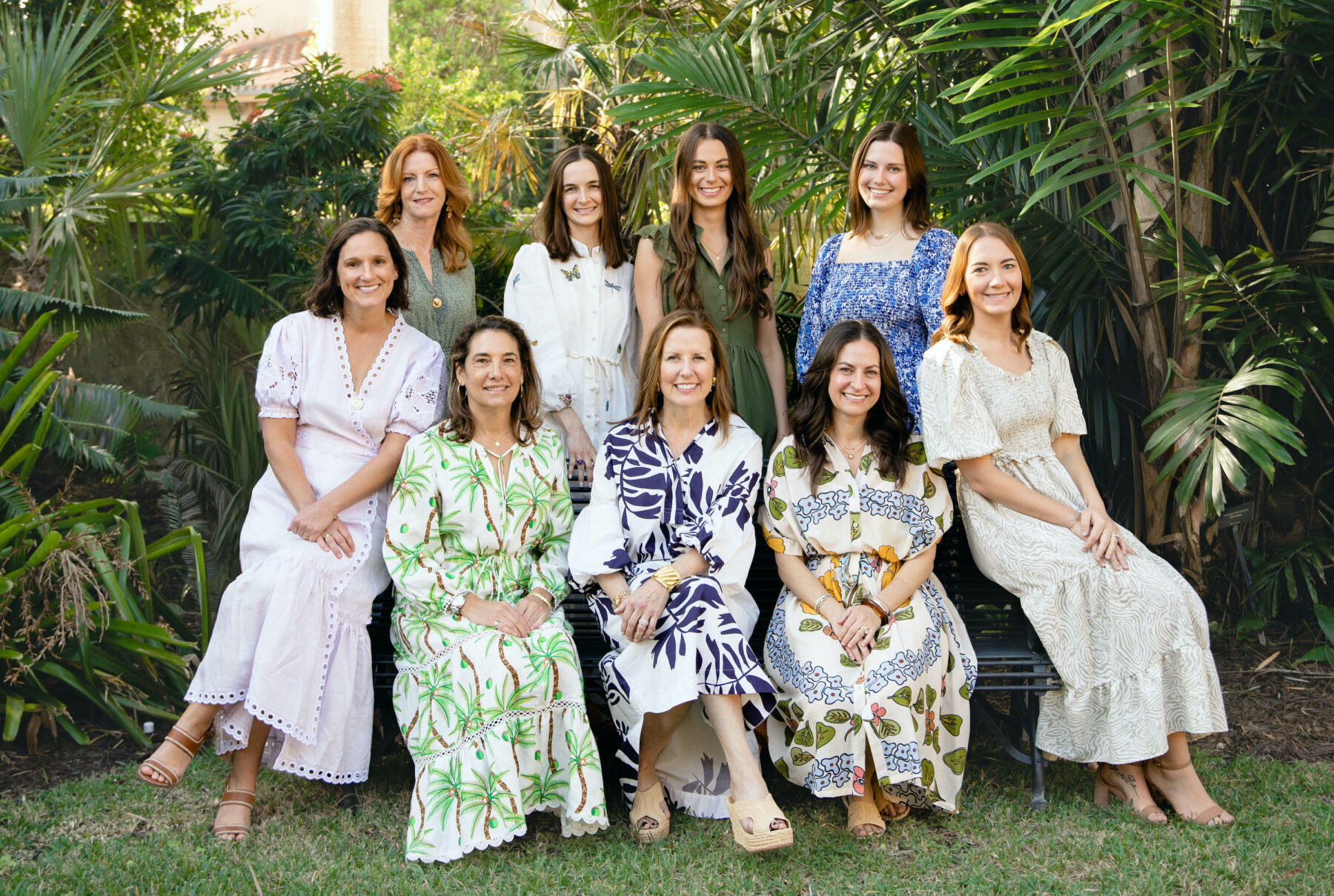 mccann design group design team seated in a tropical garden